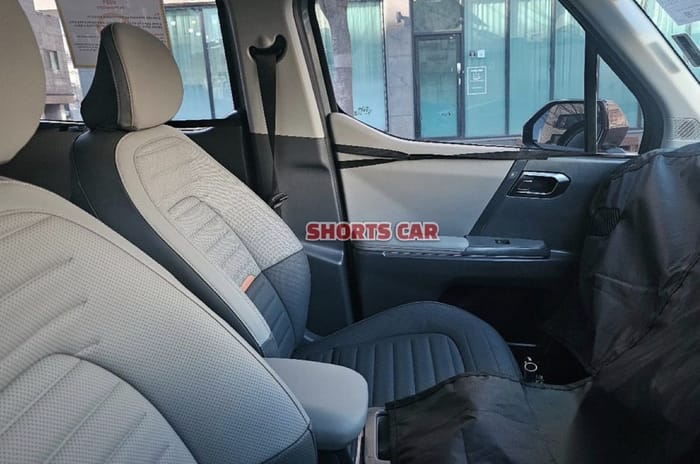 Kia Clavis spied side